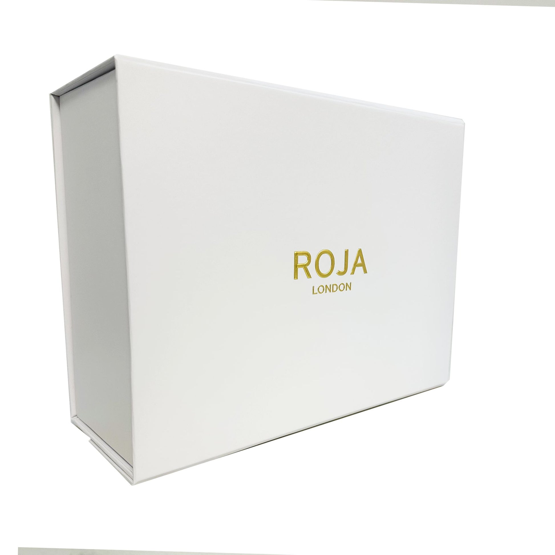 A white rectangular box with ROJA PARFUMS and ENIGMA GIFT SET in gold on the front, photographed against a plain white background—a perfect showcase for this luxurious fragrance set.