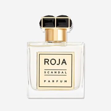 A clear glass bottle of Scandal Pour Homme by Roja Parfums, featuring a gold and black rectangular cap and a gold front labelâ€”an elegant choice for the modern gentleman who appreciates a refined FougÃ¨re fragrance.