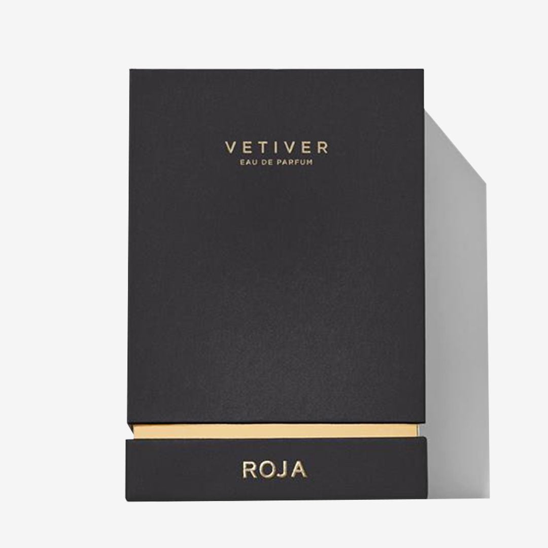 A sleek black box with gold accents labeled Vetiver Pour Homme on the front and Roja Parfums at the base hints at a bold, masculine scentâ€”ideal for those who appreciate a refined, smoky cologne.