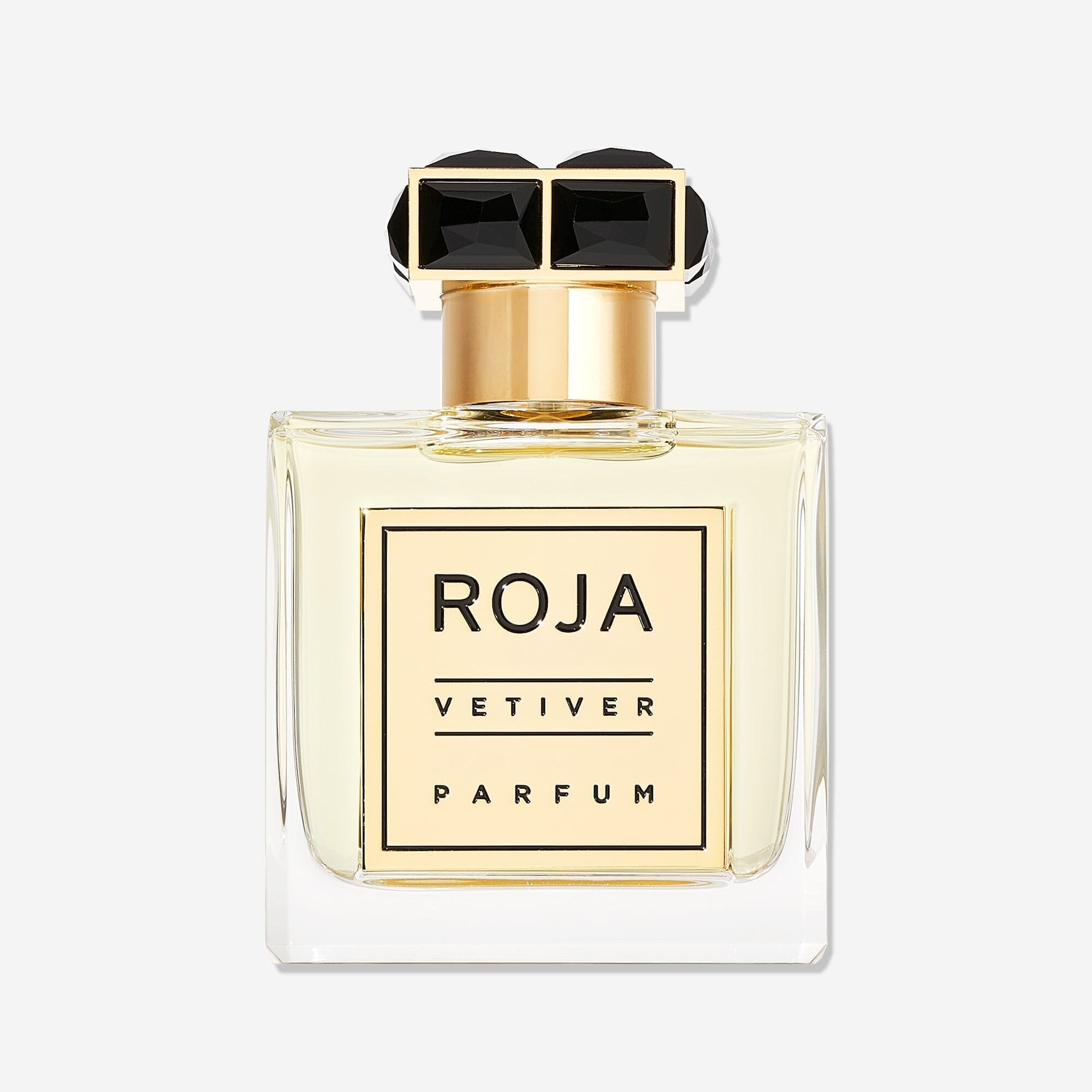 A clear glass bottle of Roja Parfums Vetiver Pour Homme holds pale yellow liquid, topped with a gold and black cap and finished with a gold labelâ€”an elegant nod to classic vetiver in masculine perfumery.
